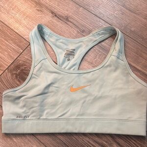 Nike Women's Dri-FIT Sports Bra - Soft Blue with Orange Swoosh